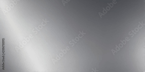 Fotografie Brushed metal texture with diagonal light reflection, conveying a modern and industrial feel