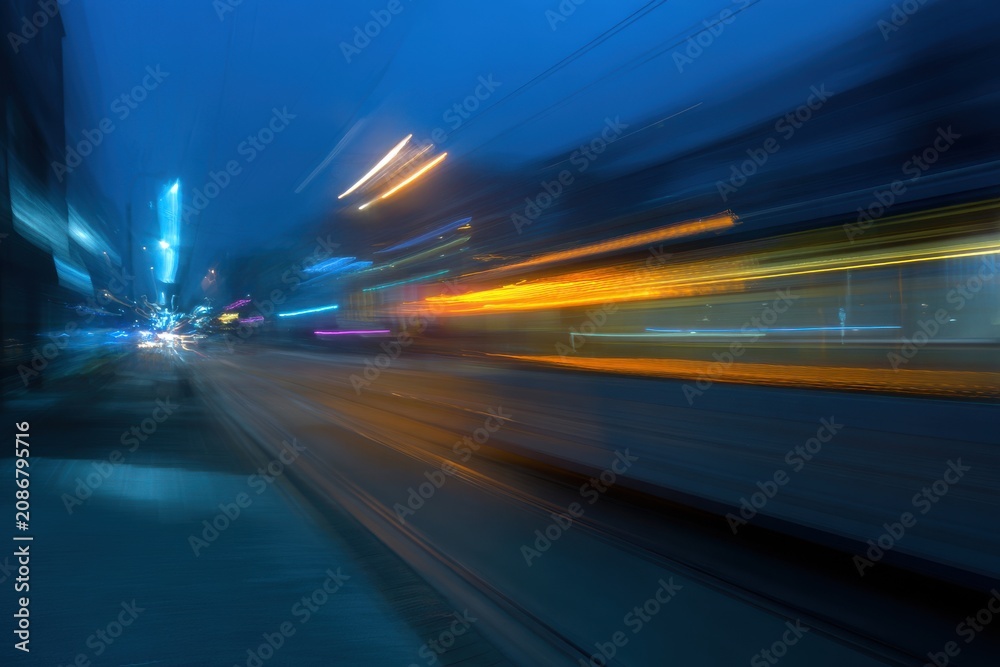 Fototapeta premium Dynamic abstract motion blur of urban night street traffic with abstract velocity movement transport exposure background direction technology rhythmic abstracted perspective shifting