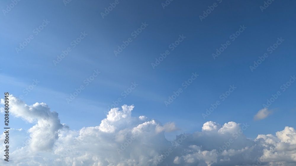 Fototapeta premium Bright Blue Sky With Fluffy White Clouds