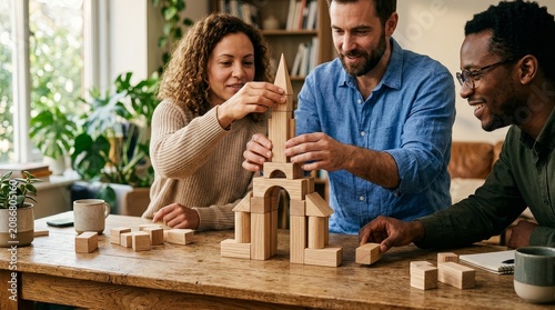 People building wooden tower together at table