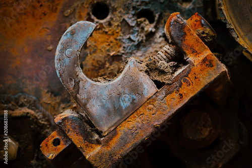 Rusted industrial machinery and corroded background