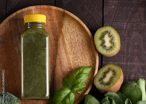 Healthy food smoothie in a bottle made from green vegetables and fruits
