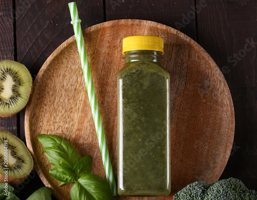 Healthy food smoothie in a bottle made from green vegetables and fruits