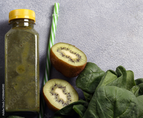 Healthy food smoothie in a bottle made from green vegetables and fruits