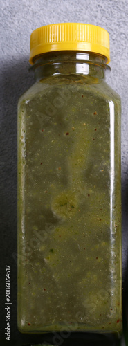 Healthy food smoothie in a bottle made from green vegetables and fruits