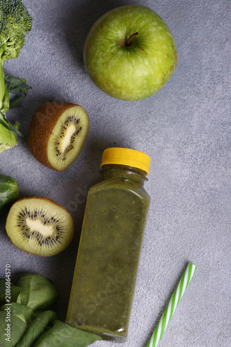 Healthy food smoothie in a bottle made from green vegetables and fruits