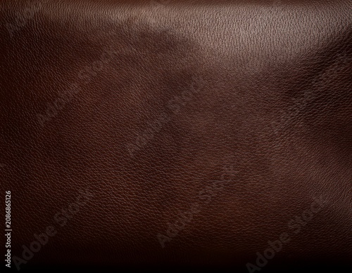 dark brown natural leather texture background with soft sheen rich tones and ample blank space for overlay centered composition for design use