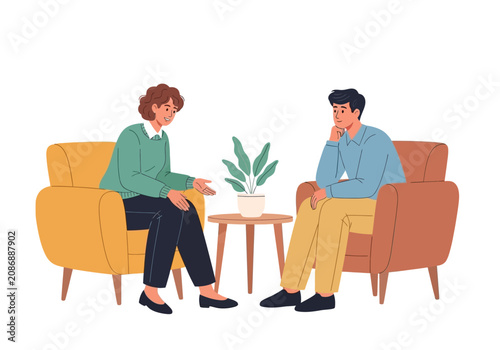 Two people sitting on armchairs talking.