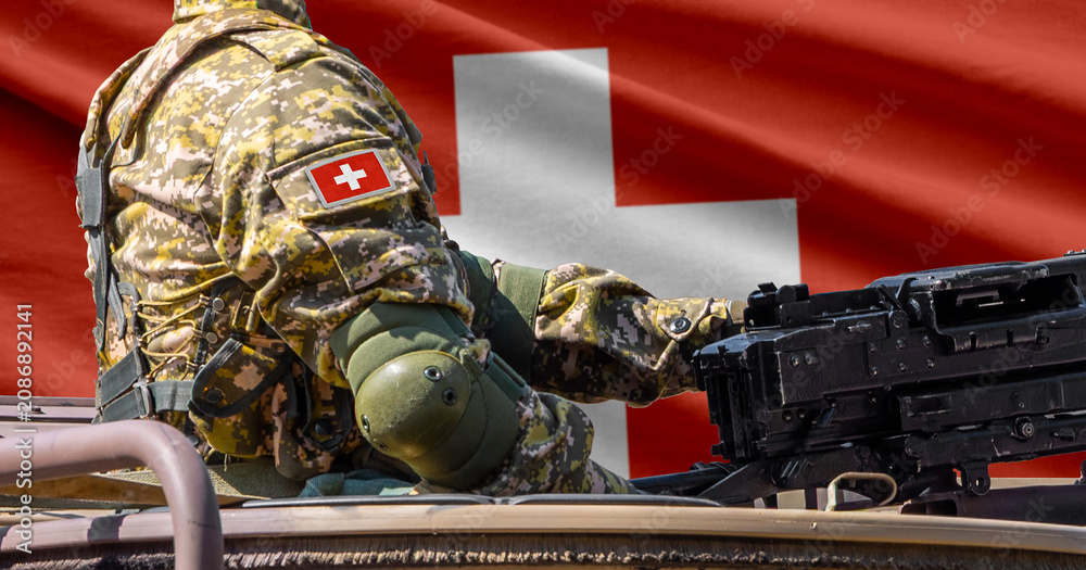 Fototapeta premium Switzerland flag with soldier at machinegun turret