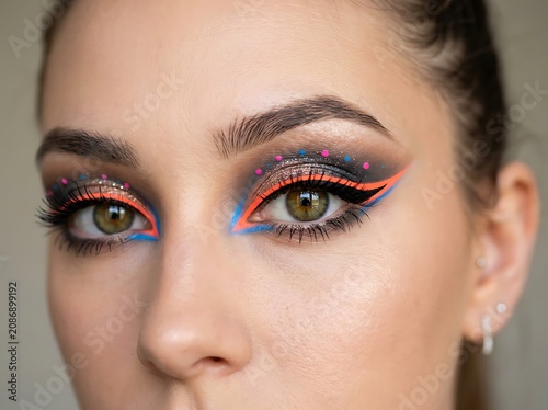 Close-up portrait of woman with striking blue eyes.