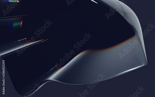 Фотография A sleek, curved, dark gray object with rainbow reflections on a dark background