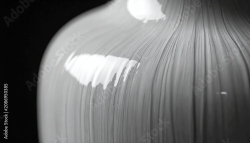 Minimalist white ceramic vase with fine vertical line texture
