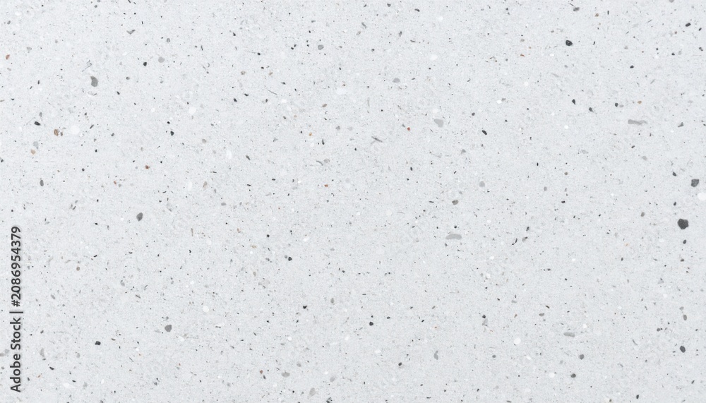 Fototapeta premium Light grey speckled granite surface texture close up with speckled background material construction