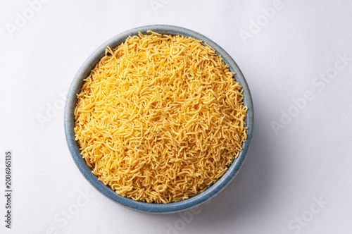 Barik Sev or sev is an important ingredient of chaat in India, made from gram flour or besan