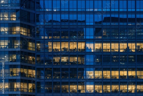City photo background for corporate banner with glass reflections and golden sunset skyline