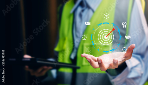 Construction goal achievement concept. Engineer presenting digital target dashboard for project planning, compliance, and performance management