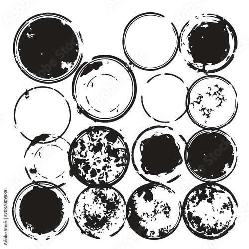 Set of grunge distressed circular ink stains and coffee ring marks with textures