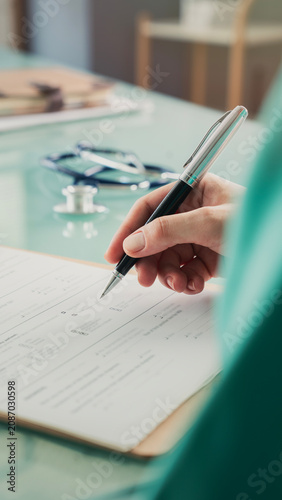 Doctor filling out the anamnesis form