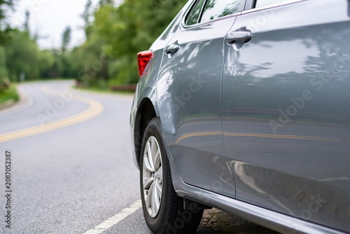The Car on a Scenic Country Road in Soft Evening Light
