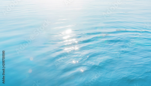 Soft blue sea surface with sparkling sunglint 爽やかな夏の光が反射する水面テクスチャ