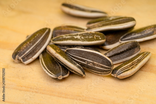 Sunflower seeds in a wooden bowl.
