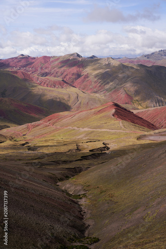 Canvas Print Stunning vast landscape of colorful red mountains under cloudy sky Peru