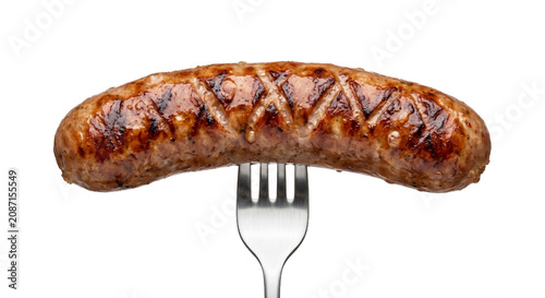 Quadro su tela Perfectly grilled sausage on a fork, ready to be eaten
