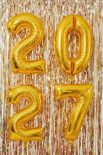 Celebration of New Year With Golden Balloons Displaying the Year 2027