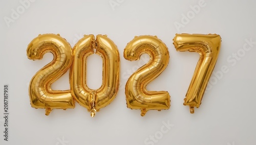 Gold Balloons Showing the Number 2027 on a Plain Background