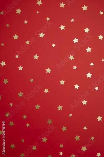 Gold Stars Scattered on a Red Background Create a Festive Atmosphere for Cele...