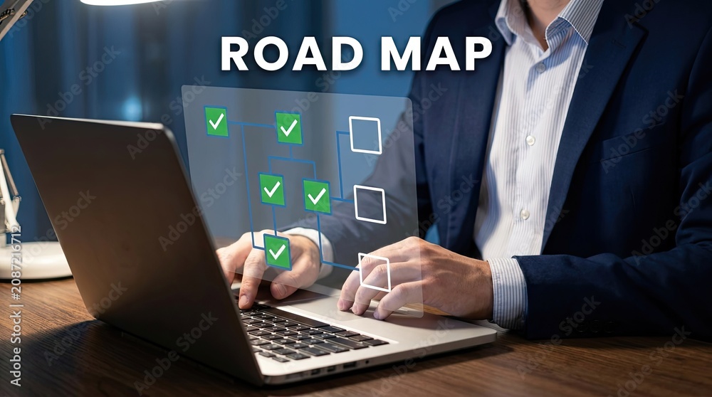 Fototapeta premium Businessman using laptop with roadmap checklist