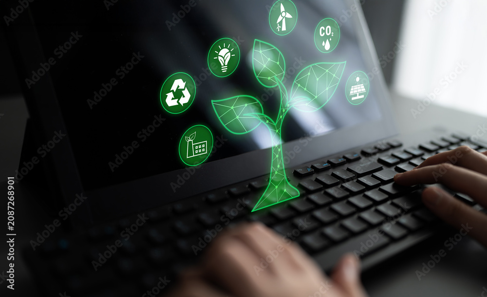Fototapeta premium Digital Connection Between Technology and Nature with Green Icons Representing Sustainability on a Laptop Screen Quark.