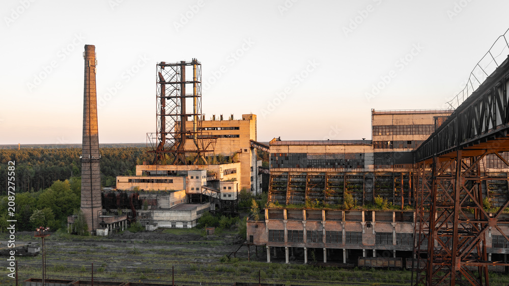 Fototapeta premium old abandoned coal company and factory. rust, coal storage buildings, galleries and conveyors