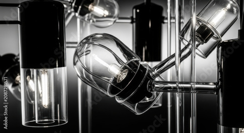 Modern Glass Cylinder Pendant Lamps With Edison Bulbs Arranged Artistically
