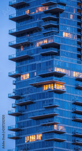 Modern Glass Skyscraper Balconies Illuminated Evening Cityscape Highrise