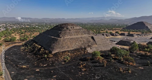 Teotihuacan Mexico Aerial v4 low level fly around pyramid of the moon, capturing avenue of the dead leading to pyramid of the sun and beautiful mountainscape - Shot with Mavic 3 Cine - December 2021