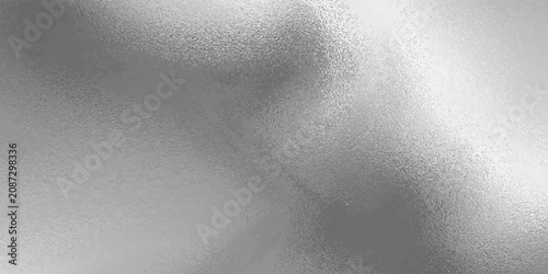 Shiny silver foil metallic texture - glossy gray steel gleaming surface, frosted glass effect with blur glare reflection, bright polished metal material. Brushed aluminum or chrome glistening bg