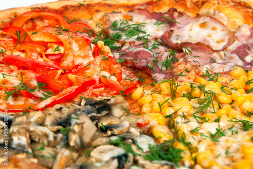 A closeups shot of baked four seasons pizza toppings with mushrooms ham sweet corn and red bell peppers. Italian fast food, macro cheesy pastry, savory dinner dish meal. Dining.