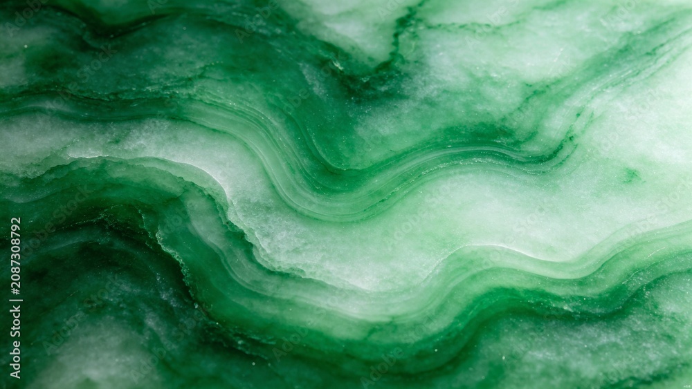 Фотография Polished nephrite jade surface with translucent green veining patterns