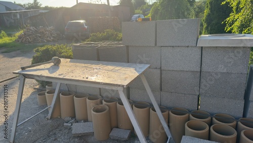Foto Construction site with concrete blocks and pipes ready for work