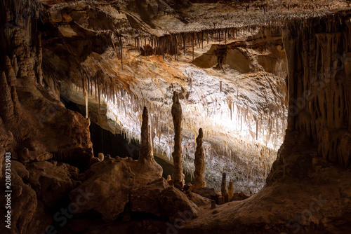 Fotografie Scenic underground cave with water and stalactites,
