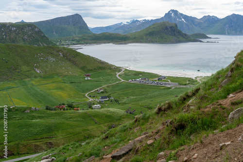 Scenic coastal valley with mountains, beach and winding road