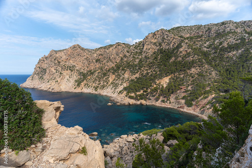 Scenic rocky bay with turquoise water and dramatic coastal cliffs