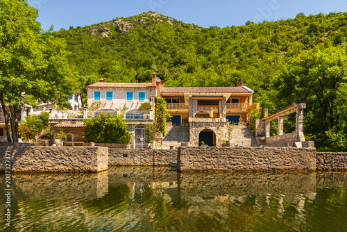 Traditional buildings along Rijeka Crnojevica river Montenegro