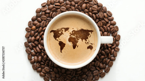 World Map Coffee Art in Cup Surrounded by Beans