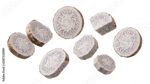 Fresh Raw Taro Root Slices and Chunks Falling in the Air Isolated on White Background for Culinary Design Use