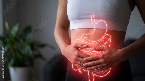 Glowing illustration of the human digestive system within a person's abdomen, highlighting the stomach and intestines in a vibrant red hue, symbolizing health and internal workings