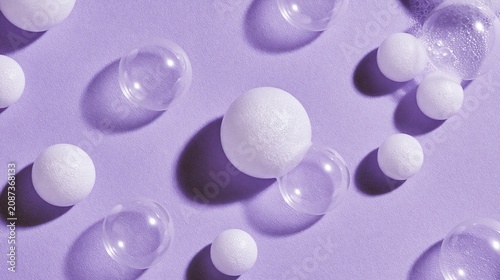 Bubbles of white soap sit on a purple background.