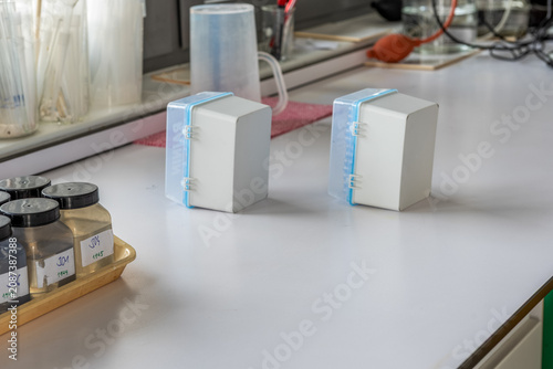 Canvastavla Laboratory sample bottles with soil samples, digital thermometer and laboratory