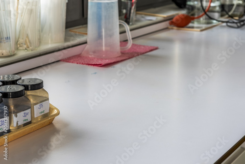 Fotografía Laboratory sample bottles with soil samples, digital thermometer and laboratory